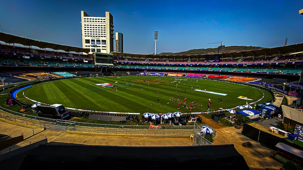 a sports field with a crowd of people in the stands